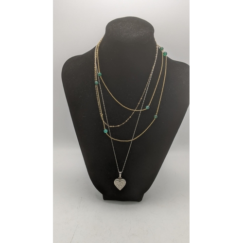 169 - Three ladies necklaces to include a 9ct gold fine link example, a 9ct gold necklace laced with jade ... 