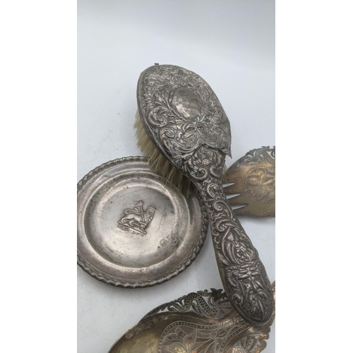 170 - Silver and white metal to include a floral embossed hand brush A/F, together with white metal Ethiop... 