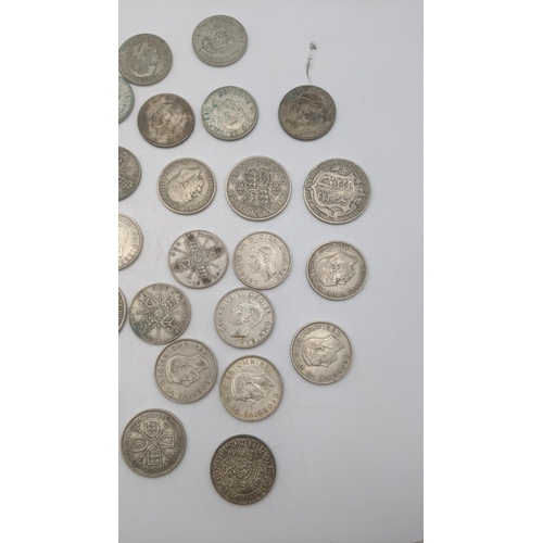 175 - A collection of 1920's/1946 British silver coinage to include one florins, two shillings, total weig... 