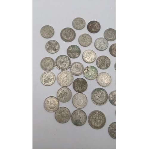 175 - A collection of 1920's/1946 British silver coinage to include one florins, two shillings, total weig... 