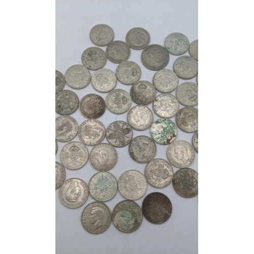 178 - A collection of 1920's/1946 British silver coinage to include Florins, two shillings 499g
Location: ... 