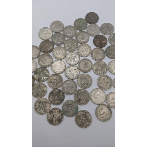 180 - A collection of 1920's/1946 British silver coinage to include two shillings and florins, total weigh... 