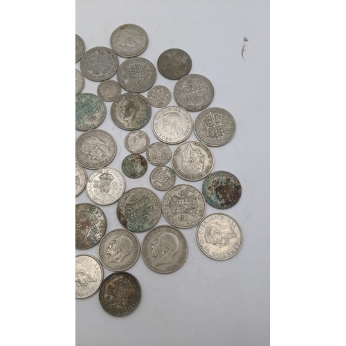 184 - A collection of 1920's/1946 British silver coinage to include two shillings and others, total weight... 