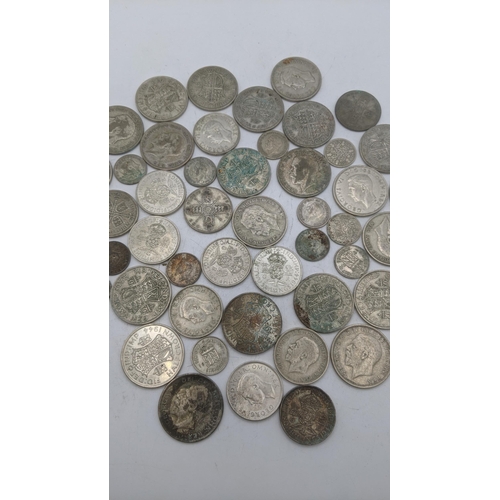 184 - A collection of 1920's/1946 British silver coinage to include two shillings and others, total weight... 