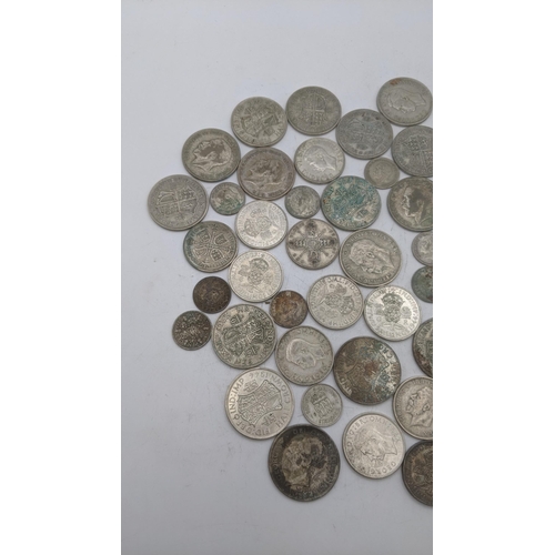 184 - A collection of 1920's/1946 British silver coinage to include two shillings and others, total weight... 