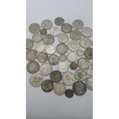 186 - A collection of 1920's/1946 British silver coinage to include six pence and others, total weight 499... 