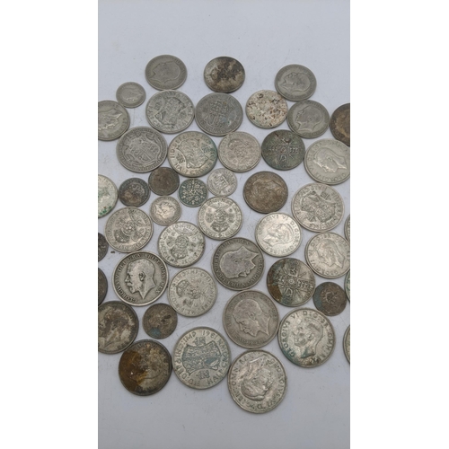 188 - A collection of 1920's/1946 silver British coinage to include half crowns and others, total weight 5... 