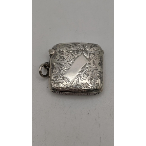 95 - A silver floral engraved vesta case having a gilt interior, hallmarked 1907, together with pair of s... 