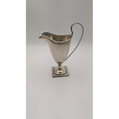 296 - A silver cream jug on a square formed base 13.5cm h x 87.7g Location: RWB
If there is no condition r... 