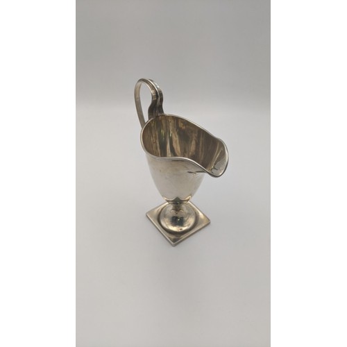 296 - A silver cream jug on a square formed base 13.5cm h x 87.7g Location: RWB
If there is no condition r... 