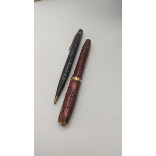 103 - A mixed lot to include two Conway Stewart pens, one example having a 14ct gold nib, boxed, together ... 