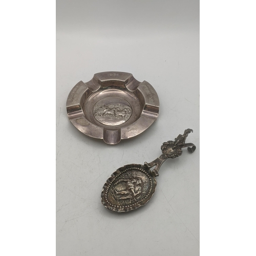 112 - Silver to include a Continental spoon with embossed bowl depicting a lady and gentleman dancing havi... 