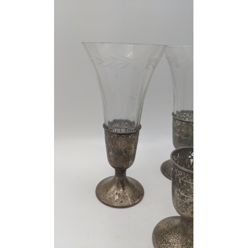 118 - Three sterling silver cut glass vases, along with one extra base, along with a silver eggcup, total ... 