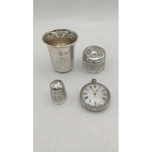 122 - Silver collectables to include an early 20th century open faced keyless pocket watch, along with a s... 