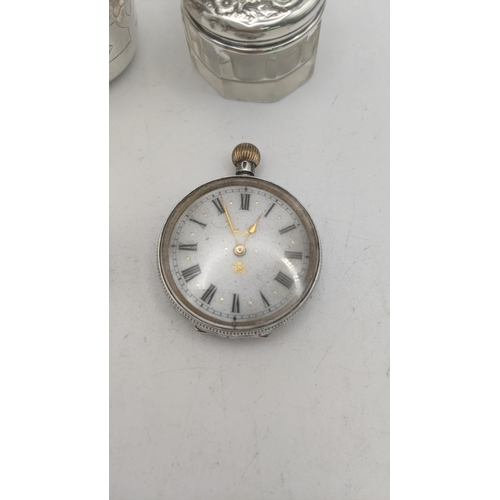 122 - Silver collectables to include an early 20th century open faced keyless pocket watch, along with a s... 