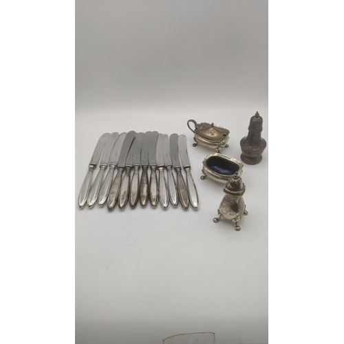 133 - Mixed silver to include two pepper pots, two condiment pots and 12 silver handled butter knives Loca... 