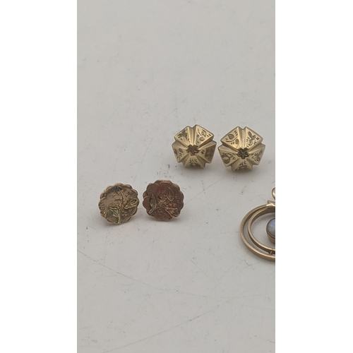 135 - Mixed 9ct gold and a pair of yellow metal stud earrings having floral engraved detail, together with... 