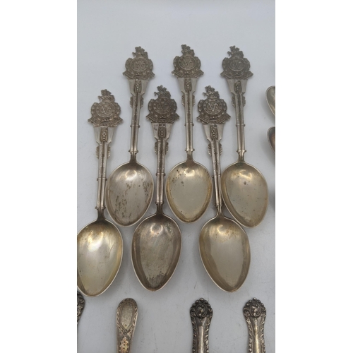 140 - Silver teaspoons to include a set of six Law and Order collector's spoons and others, total weight 2... 