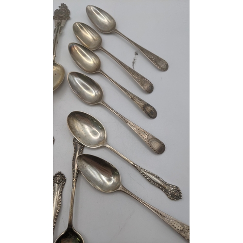 140 - Silver teaspoons to include a set of six Law and Order collector's spoons and others, total weight 2... 