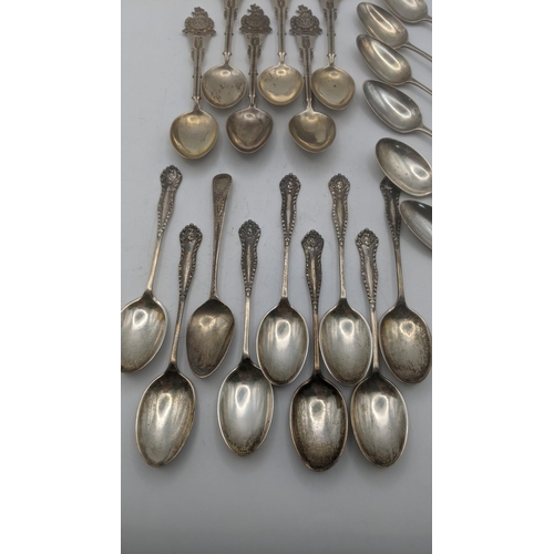 140 - Silver teaspoons to include a set of six Law and Order collector's spoons and others, total weight 2... 