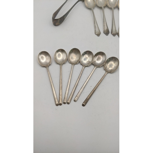 141 - A collection of silver teaspoons, together with a pair of silver sugar tongs hallmarked Sheffield 19... 