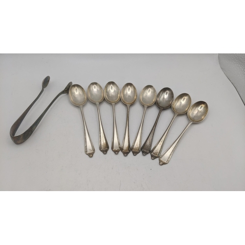 141 - A collection of silver teaspoons, together with a pair of silver sugar tongs hallmarked Sheffield 19... 