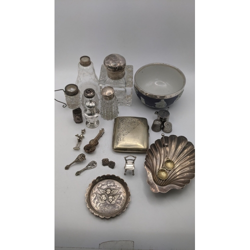 144 - Mixed silver white metal items to include a miniature chair and others, together with an embossed pi... 