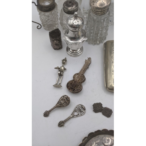 144 - Mixed silver white metal items to include a miniature chair and others, together with an embossed pi... 