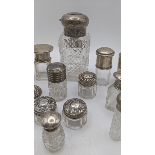 153 - A mixed lot of silver and crystal cut glass scent bottles and dressing table jars, together with a p... 