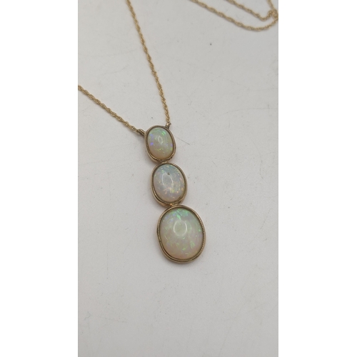 155 - A 9ct gold necklace with a three stone opal pendant mounted in 9ct yellow gold 3.1g A/F Location:CAB... 