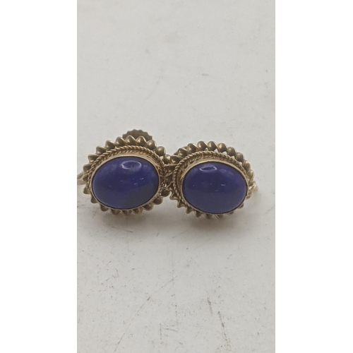 160 - Two pairs of 9ct yellow gold earrings to include a pair set with lapis lazuli, and the other set wit... 