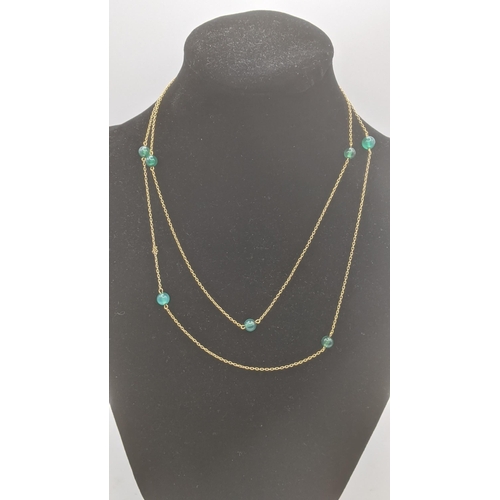 169 - Three ladies necklaces to include a 9ct gold fine link example, a 9ct gold necklace laced with jade ... 