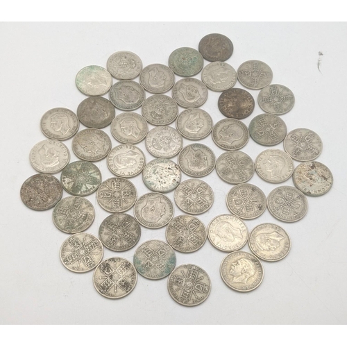 180 - A collection of 1920's/1946 British silver coinage to include two shillings and florins, total weigh... 