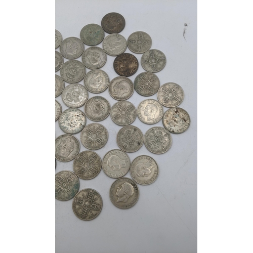 180 - A collection of 1920's/1946 British silver coinage to include two shillings and florins, total weigh... 