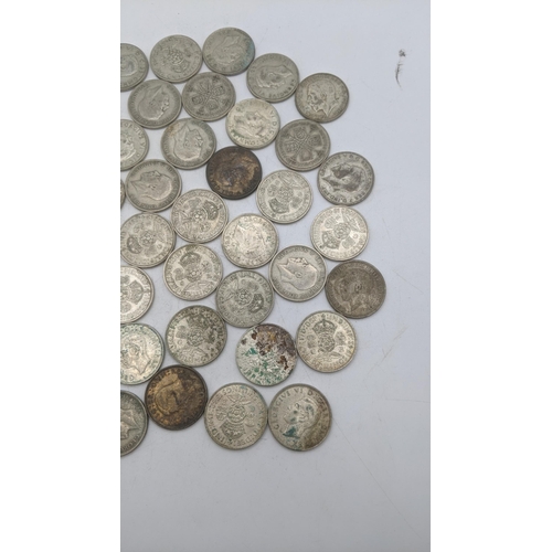 183 - A collection of 1920's/1946 British silver coinage to include two shillings and others, total weight... 