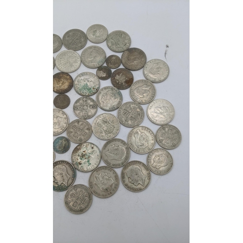 185 - A collection of 1920's/1946 British silver coinage to include Florins and others, total weight 499.1... 