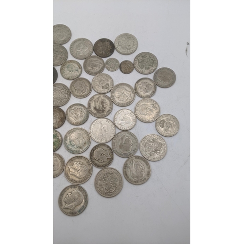 187 - A collection of 1920's/1946 British silver coinage to include half crowns and others, total weight 5... 