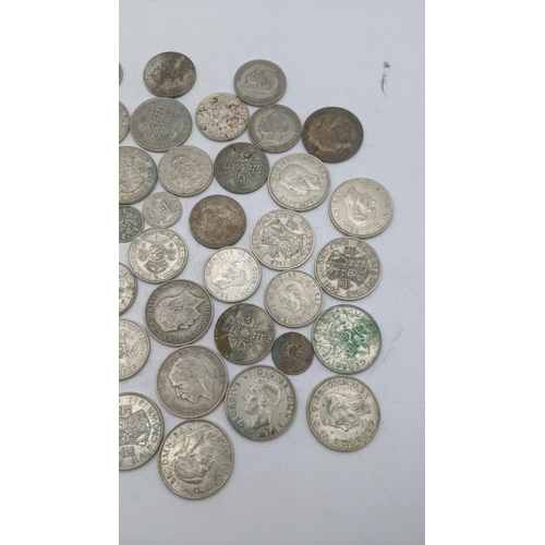 188 - A collection of 1920's/1946 silver British coinage to include half crowns and others, total weight 5... 