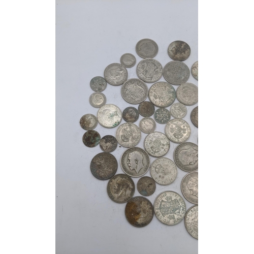 188 - A collection of 1920's/1946 silver British coinage to include half crowns and others, total weight 5... 