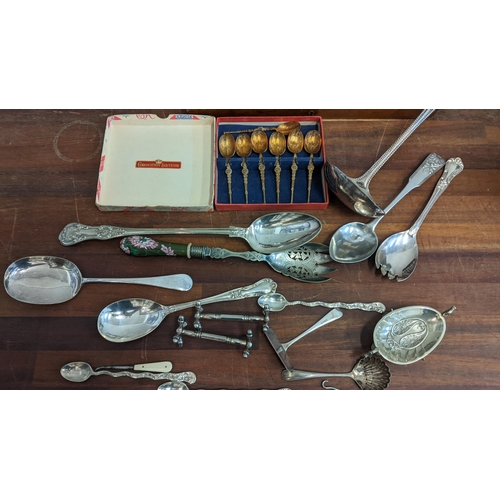 249 - A collection of silver plate to include a boxed canteen of cutlery, an embroidered teapot, a box of ... 