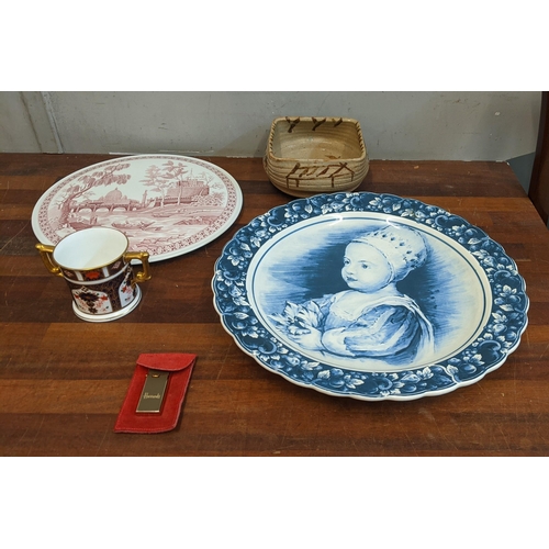 256 - Ceramics to include a Royal Crown Derby twin handled mug, a Delft charger, a Spode cake plate and a ... 