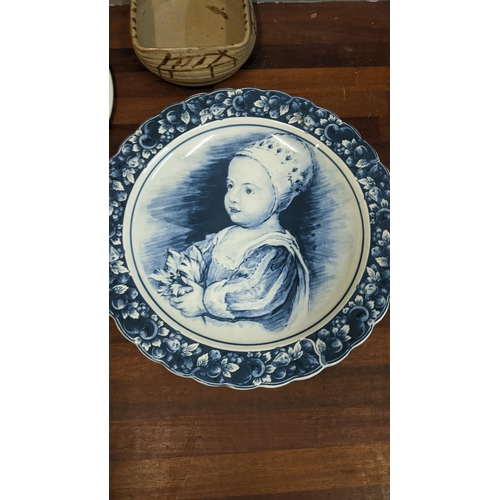 256 - Ceramics to include a Royal Crown Derby twin handled mug, a Delft charger, a Spode cake plate and a ... 