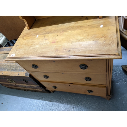 262 - Late Victorian pine dressing chest, swing mirror above open shelf, base with three graduated drawers... 