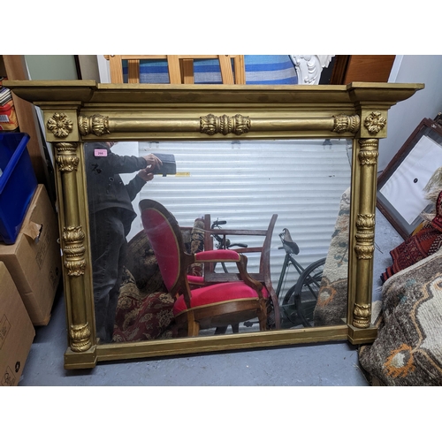 266 - A Victorian gilt gesso wood framed overmantel mirror decorated with stylized flower heads to each to... 