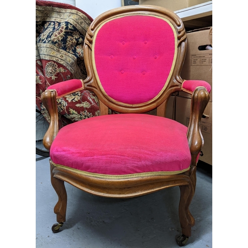 267 - An early 20th century mahogany framed upholstered open armchair with carved decoration, upholstered ... 