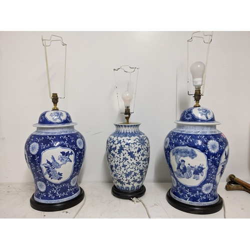 271 - A pair of modern Chinese blue and white inverted baluster table lamps on ebonized wooden bases, and ... 