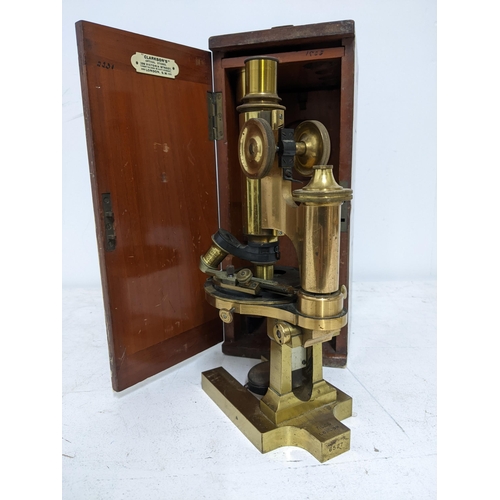 275 - A Ross of London brass microscope number 6527 with additional lens in mahogany case, retailer's labe... 