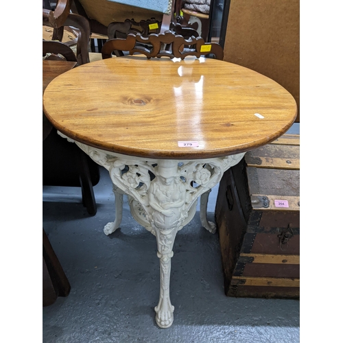 279 - Two white painted cast iron pub tables with circular wooden tops, 70cm h Location:
If there is no co... 