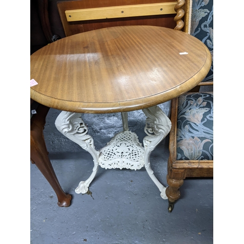 279 - Two white painted cast iron pub tables with circular wooden tops, 70cm h Location:
If there is no co... 