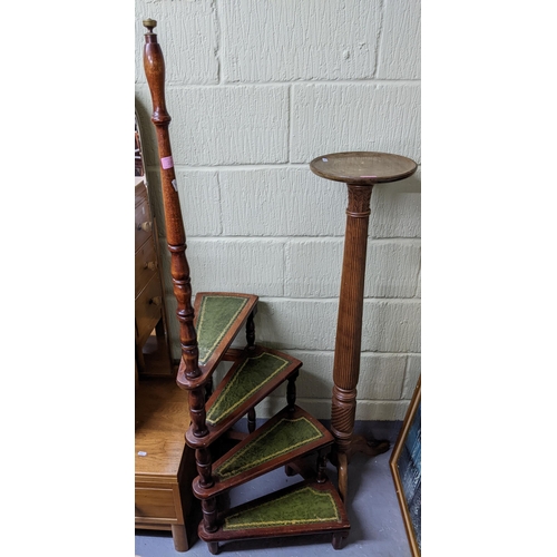 286 - A mahogany pedestal plant stand on three splayed legs, 121cm h, and a reproduction mahogany library ... 